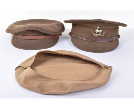 1922 Pattern Royal Warwickshire Regiment Other Ranks Service Dress Peaked Cap, good example of khaki wool with bi-metal other