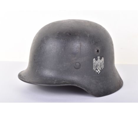 WW2 German Army Steel Combat Helmet, fine example of a M-35 pattern shell which has a thick textured paint finish to the exte