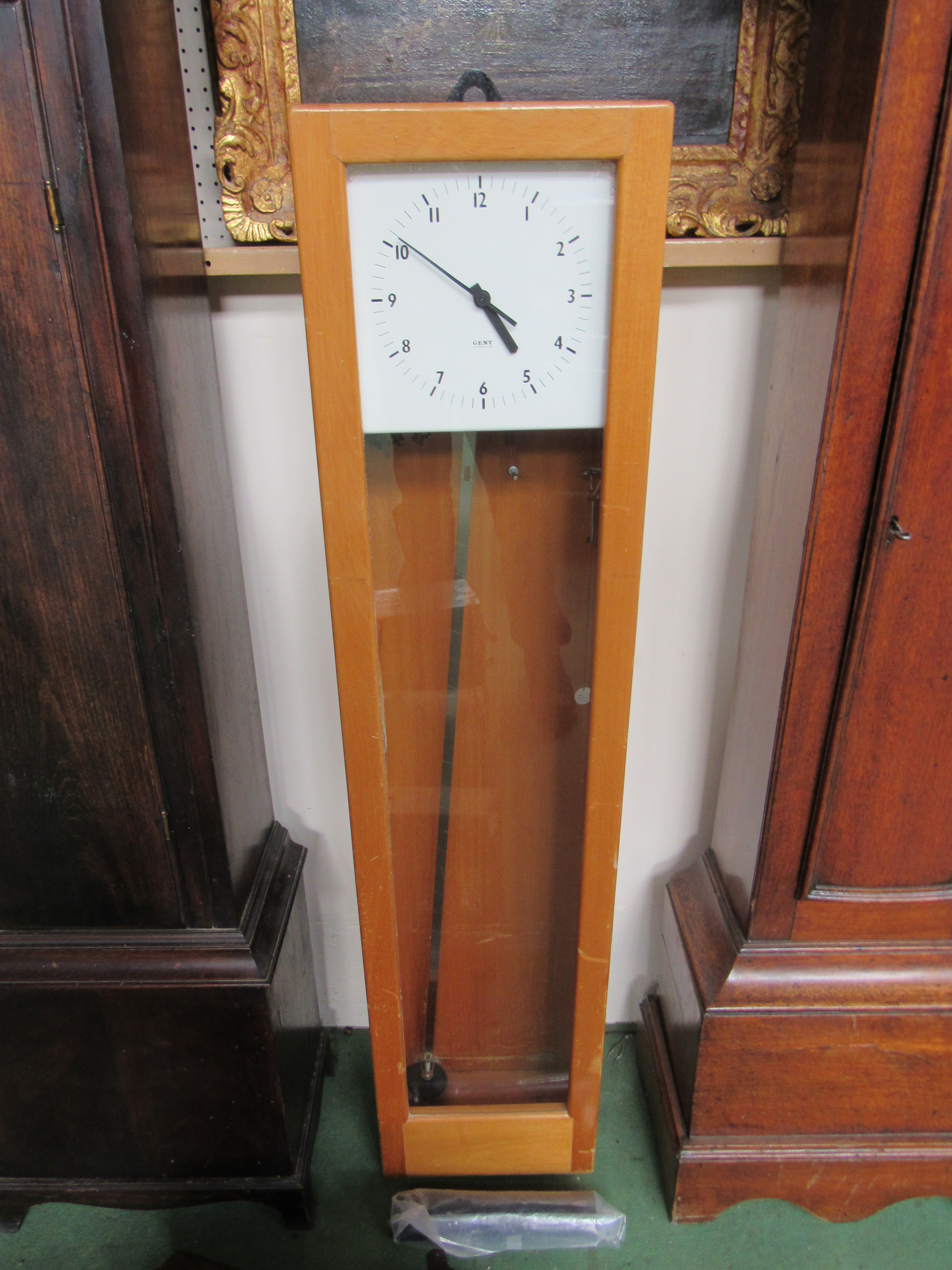 A Gent master clock with 6" door dial and intsruction book, serial 1234, pendulum an