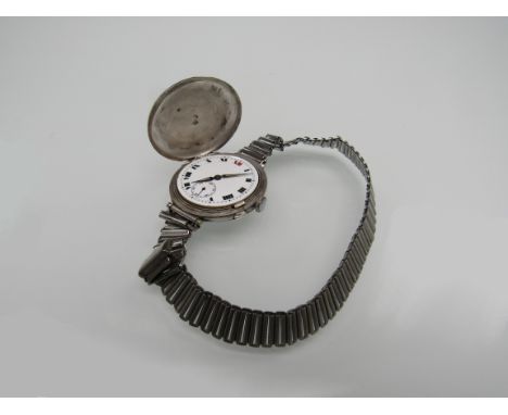 An early 20th Century Longines silver hunter trench wristwatch, Roman enamel dial with subsidiary seconds a/f