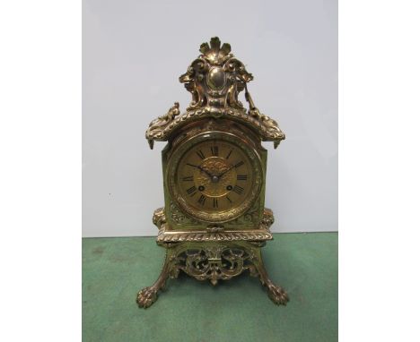 A brass cased mantel clock of decorative classical style with brass Roman chapter ring, 8 day movement, 35cm high