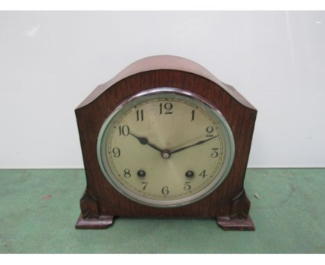 An oak mantel clock with Arabic silvered dial and Garrard 8 day movement striking a coiled gong, key and pendulum, 20.5cm hig
