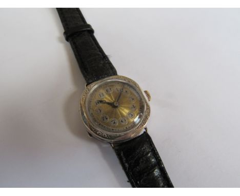 An early 20th Century silver cased wristwatch with Arabic cartouche chapter rings and engine turned dial, Sheffiled 1918, box