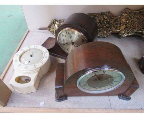 Two oak mantel clocks and a Smith's eight day bakelite wall clock 