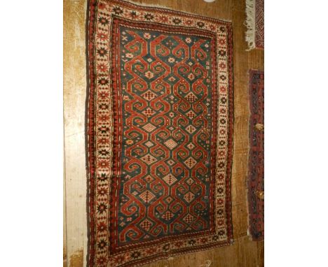 A Caucasian cream ground balouch runner carpet, decorated with geometric pattern to centre, multi-bordered and fringed. L.117