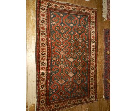 A Caucasian cream ground balouch runner carpet, decorated with geometric pattern to centre, multi-bordered and fringed. L.117