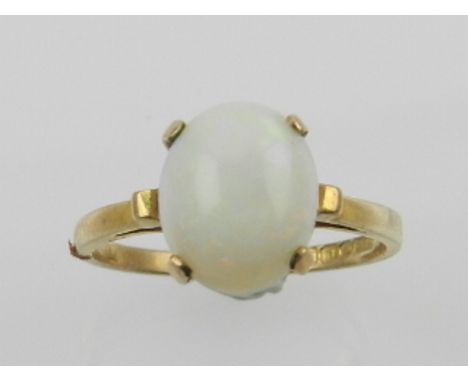 A 9 carat yellow gold and opal set ring. 