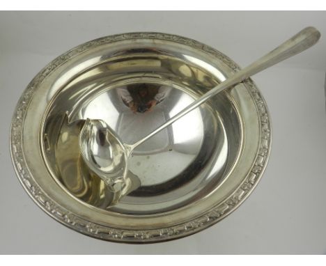 A silver plated punch bowl twelve cups, and a ladle.