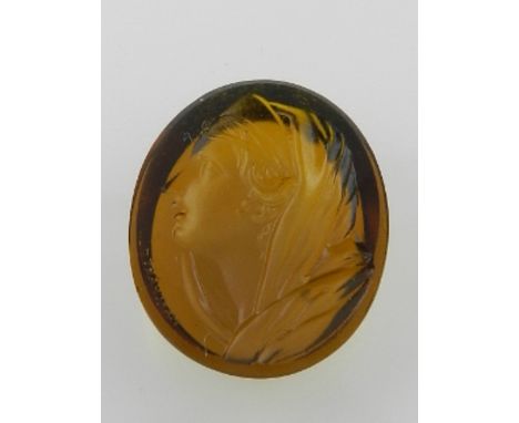 An unmounted glass intaglio by Nathanial Marchant (1739-1816), profile portrait of a lady