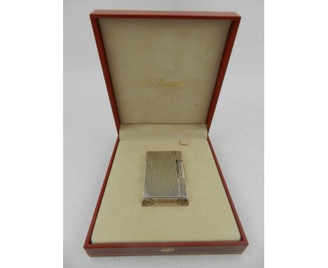 A white metal Dupont lighter, cased.