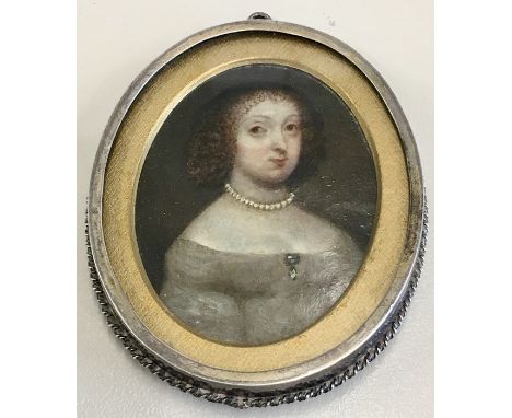 Early miniature portrait of a lady unmarked comes in a white metal frame measures approx 8.5cm by 7cm 