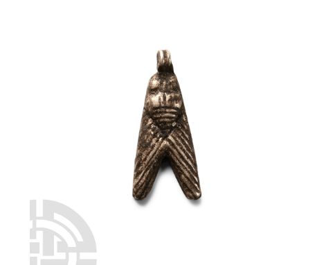 Late Period, 664-332 B.C.. With linear detailing to body and wings, loop above the neck. Cf. Andrews, C., Amulets of Ancient 