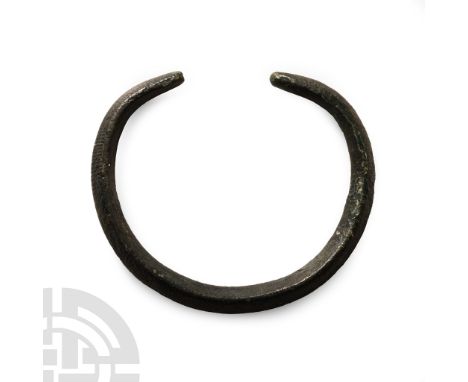 Mid 2nd millennium B.C.. Lozengiform in section with tapering finials, panels of hatching to the outer faces.  38.2 grams, 64