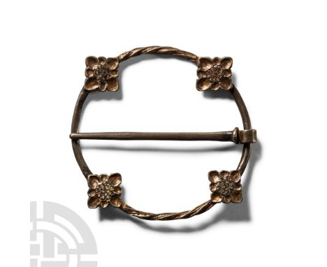 13th-14th century A.D.. With slender hoop and four applied quatrefoil plates, alternating plain and twisted hoop sections; fr