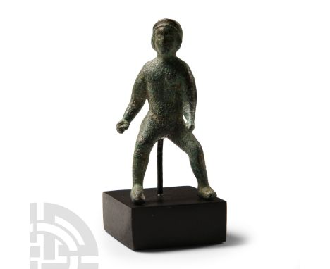 1st-2nd century A.D.. Modelled nude with legs thrust forward, left arm forward from the body, right arm held to the rear with