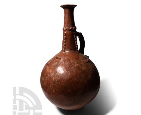 Early Bronze Age, circa 2700-1900 B.C.. Comprising a large spherical body with two ledge handles to the shoulder, tapering ne