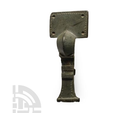 Circa 6th century A.D.. A bow brooch of small-long type with rectangular headplate, deep carinated bow, flared footplate with
