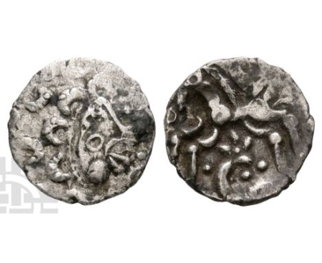 50 BC-AD 50.. Profile moon head (type B) to right, pelleted crescents for hair, large boss on chin, stalk lips / Celtic tripl