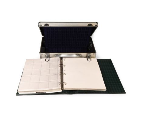 21st century AD.. Near-new case with two blue velour trays for a range of coin sizes, lockable with four keys; a large cased 