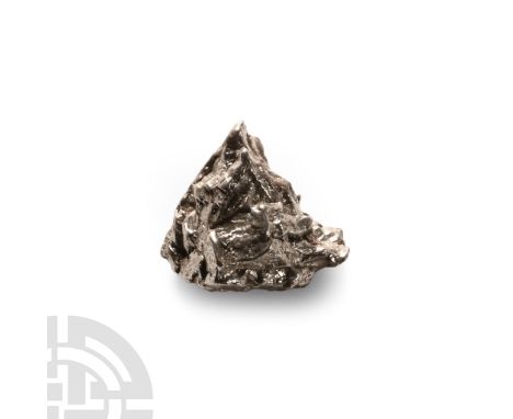 Fell 6000-5000 years B.P.. A nickel-iron meteorite (IAB).  25.3 grams, 25 mm (1 in.). A crater field of roughly 26 craters wa