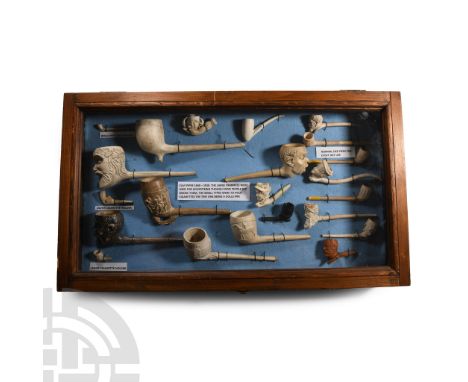 1840-1910 A.D.. Collection of mainly white-clay moulded smoking pipes; many with a caricature head forming the bowl, such as 