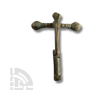 4th century A.D.. With three onion-shaped knops on the crossbar and stepped upper face, narrow bow, rectangular footplate wit
