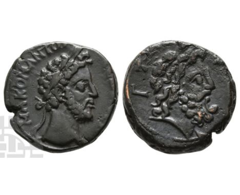 AD 177-192.. M A KOM ANT? [C?B ?V C?B], laureate head to right / Laureate head of Zeus to right, with traces of drapery; L K[