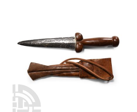 15th century A.D. and later. Hand-forged two-edged iron knife blade with modern replacement hilt and leather sheath with sadd