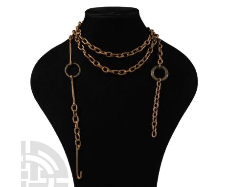 16th century A.D.. Long chain of ellipsoid link with central ring and two stringers, hooked end for adjustment; thick ring to