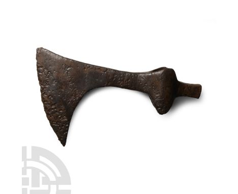 Circa 12th-13th century A.D.. Comprising a flat socket with lateral spurs, slender neck developing to a broad blade with curv
