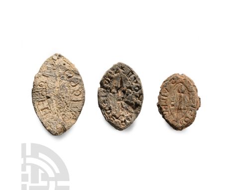 13th century A.D.. Each vesica-shaped, with central fleur-de-lys or other motif and surrounding legend.  53.1 grams total, 29