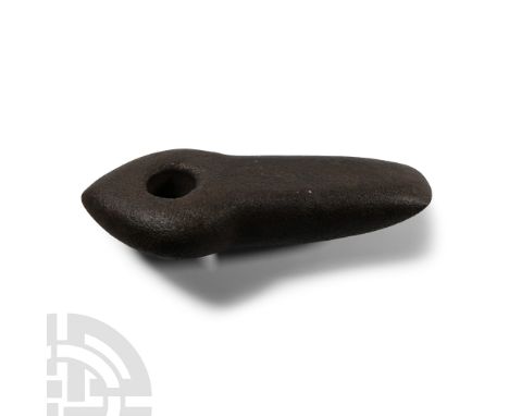 Neolithic Period, circa 5th-3rd millennium B.C.. The blade triangular in section with chamfered forward edge, slightly curved