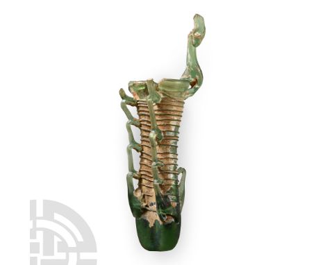 4th century A.D.. Comprising two parallel tubes joined at the base and sides, each with flared rim and covered with fine glas