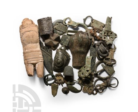 16th-20th century A.D.. Including a ceramic figurine, strap end, belt buckle, key handle, sheath chape and other items.  560 