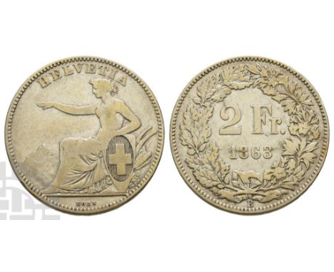 Dated 1863.. HELVETIA , Helvetia seated to left, wearing laurel wreath and toga, with right arm raised, and holding shield wi