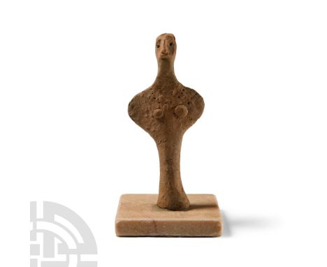 Circa 13th century B.C.. Standing on a conical foot with rounded upper body, applied disc breasts, impressed necklace, pinche