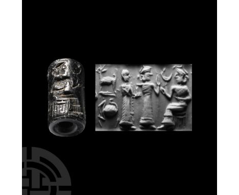 UR III, 22ND-21ST CENTURY B.C.&nbsp;With broad central piercing, frieze with seated king in a tiered robe facing two robed su
