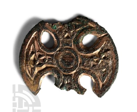 8th century A.D.. Fragment of a discoid pin-head with openwork cross detailing and Insular Style interlace radiating from a c