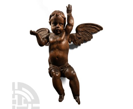 18th century A.D.. Figure carved in the round with draped cloth to the thighs, wings spread, arms raised and hands open to su