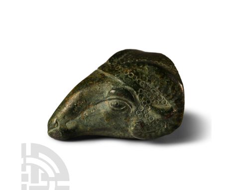 6th century B.C.. Hollow-formed finial in the form of a ram's head with punched annulet texture detailing. Cf. The Metropolit