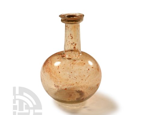 3rd-4th century A.D.. With globular body and long tubular neck, dimple base, everted rim with gusset to the outer edge; wheel