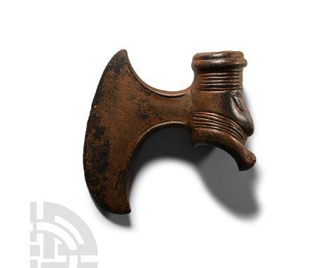 2nd millennium B.C.. With crescentic blade and rounded knot at the butt, ornamental curved edging to the upper shaft hole, a 