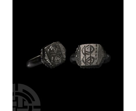 Circa 16th century A.D.. Comprising a broad hoop with pad to the underside, hexagonal bezel with lateral notched flange, inci