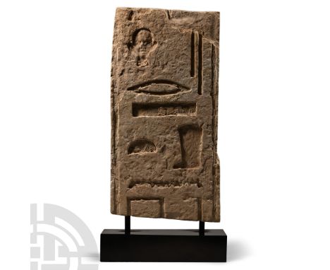 Old Kingdom, 2686-2181 B.C.. Rectangular panel carved in sunk relief with vertical borders framing a portion of hieroglyphic 