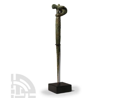 1st millennium B.C.. With barrel-shaped upper and tapering body, modelled with coil detailing around the upper body, tiered r