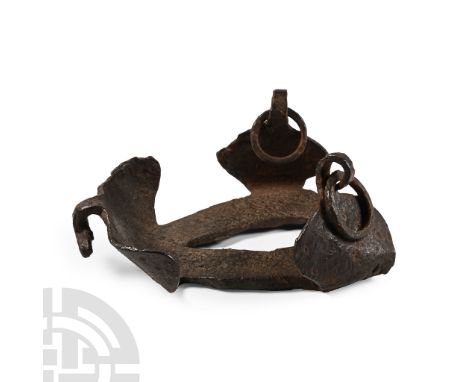 1st-4th century A.D.. Iron shoe with lateral curved plates with attachment rings rear panel with bar also for attachment. Cf.