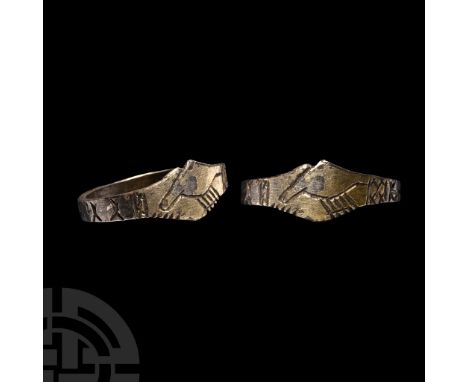 15th-16th century A.D.. Comprising a square-section shank and bezel formed as two clasped hands; hatched band to each cuff; p