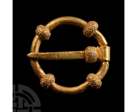 13th century A.D.. Annular in form with four granulated bulbs; straightened and with replicant pin. Cf. Egan, G. &amp; Pritch