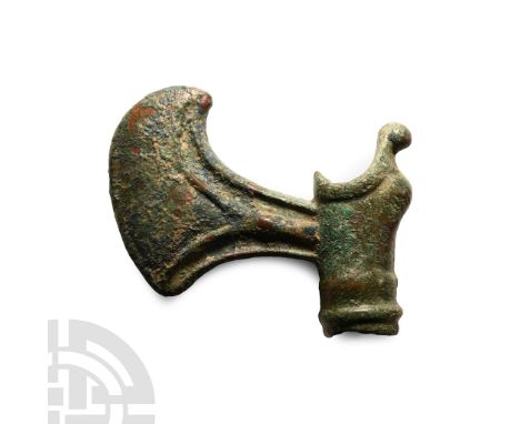 2nd millennium B.C.. With crescent blade and rounded knot at the butt, ornamental curved edging to the upper shaft hole, a co