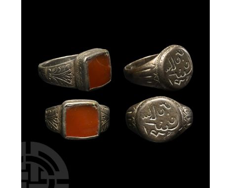 18th-19th century A.D.. Comprising: one with a flat-section hoop with incised decoration to the expanding shoulders, square b